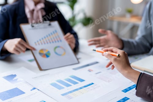 Preview: Businesspeople analyzing business data on charts and graph on paperwork, financial concept