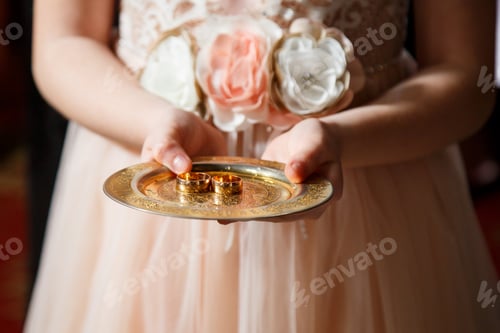 Preview: Golden wedding rings for newlyweds on their wedding day