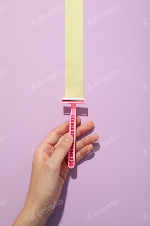 Preview: Pink razor for shaving on a beautiful background