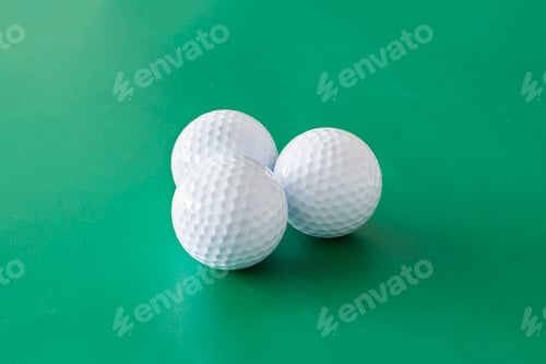 Preview: Golf balls on the green background