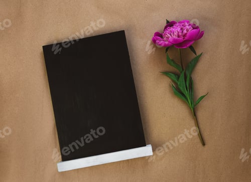 Preview: Blank chalkboard mockup with pink peony on brown kraft paper background.