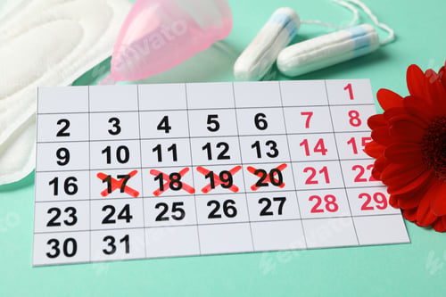 Preview: Menstruation period concept on mint background, close up