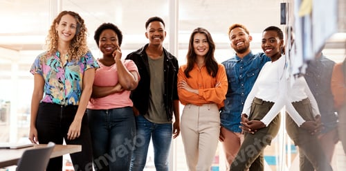 Preview: Cropped portrait of a group of young designers standing in the boardroom of their office