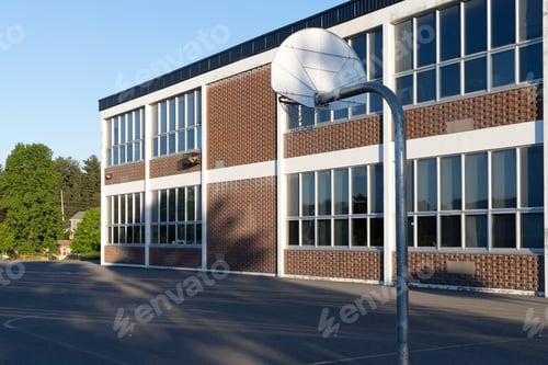 Preview: School building and school yard with basketball court