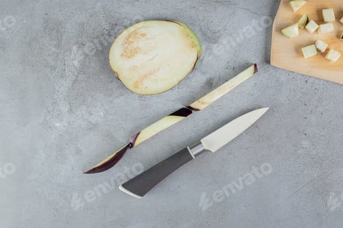 Preview: Sliced fresh vegetable with oil on a gray background