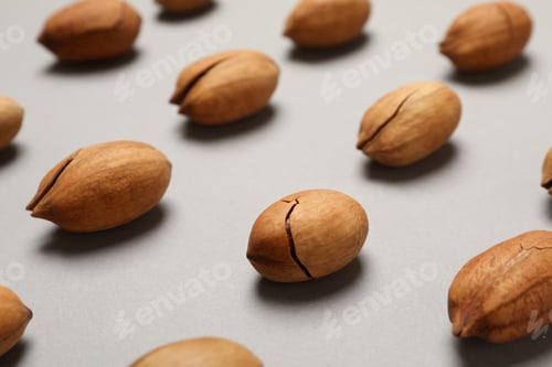 Preview: Flat lay with tasty pecan nuts on gray background