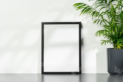 Preview: Black wooden photo frame and plant on gray background