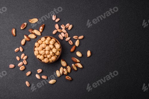 Preview: Whole peeled hazelnuts, roasted or raw, as an ingredient for healthy food. Hazelnuts as a background