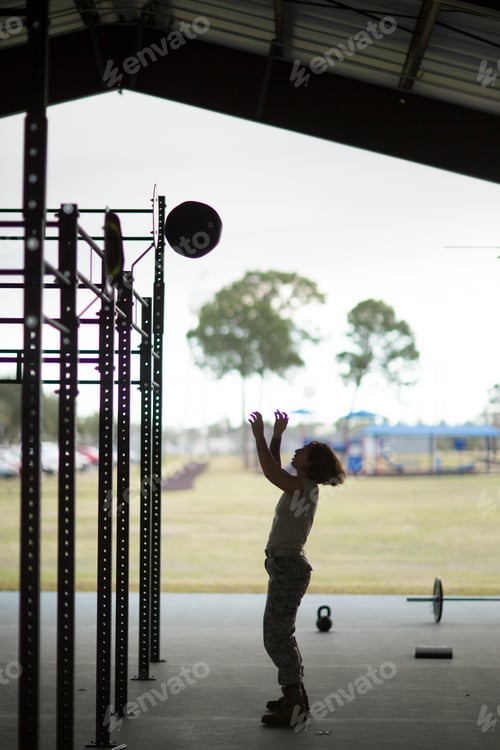 Preview: Female soldier throwing ball to target at military air force base