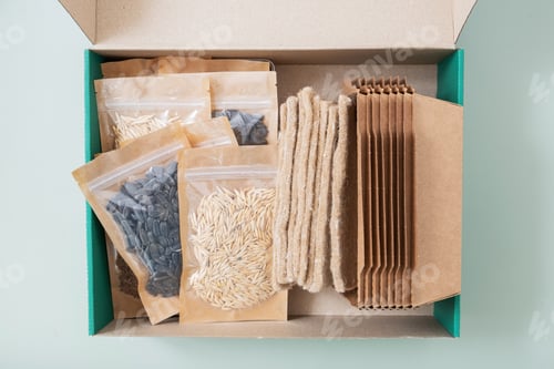 Preview: Set for growing sprouts from seeds. Seeds, linen mats, boxes and lids flat lay, top view