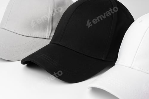 Preview: Lineup of Four Blank Baseball Caps in Red, White, and Black on a White Background