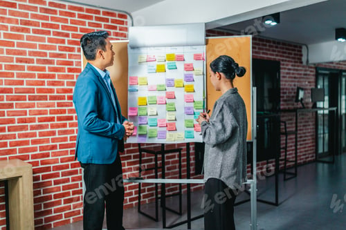 Preview: Professional Colleagues Brainstorming Ideas in a Modern Collaborative Workspace