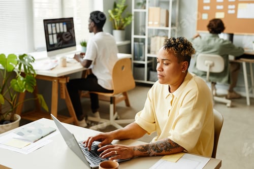 Preview: Tattooed Black Woman at Workplace