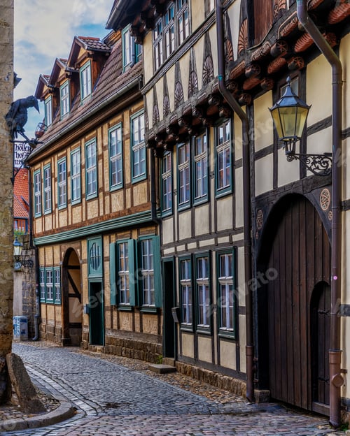 Preview: Cobblestone street with historic buildings in Quedlinburg, Germany