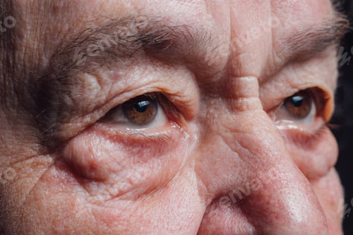 Preview: Seniors eyes close up, contemplative old caucasian woman