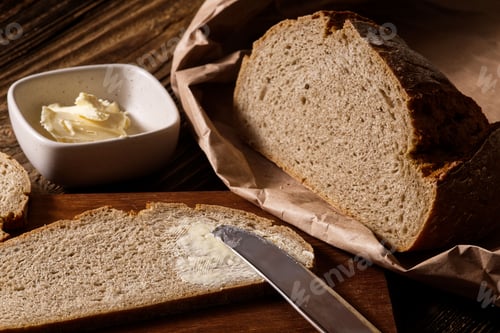 Preview: Fresh loaf of bread with butter