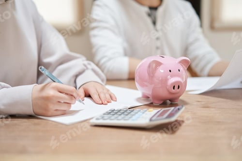 Preview: Asian couple reviewing household budget