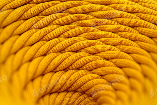 Preview: Skein of yellow braided synthetic cord, close-up shot