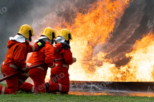 Preview: Firefighters or Firemen use extinguisher and spray high pressure water from hose to control fire