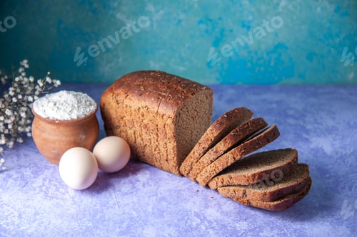 Preview: Above view of black bread slices flour eggs on light ice blue pattern background with free space