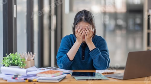 Preview: Portrait of tired young business Asian woman work with documents tax laptop computer in office. Sad,