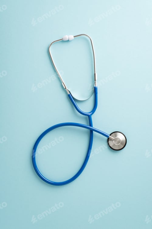 Preview: Health Essentials: A vertical top-view image of blue stethoscope on a pastel blue backdrop