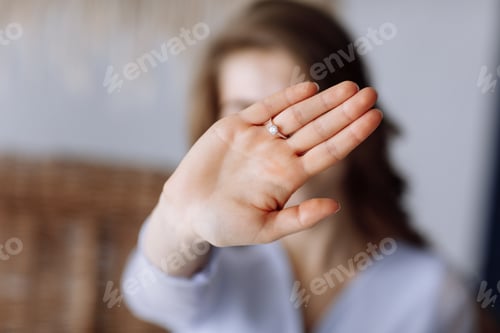 Preview: young woman shows a ring with diamond. The girl shows an engagement ring on her finger. she said yes