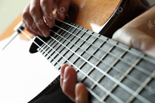 Preview: Musician playing on classical guitar, close up and selective focus