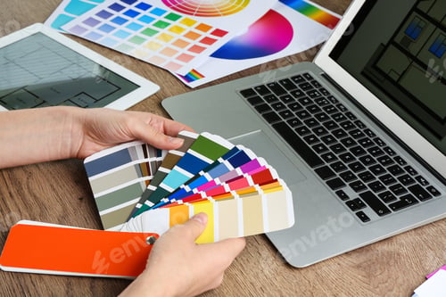 Preview: Woman with palette samples at wooden table, closeup