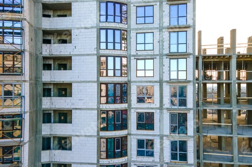 Preview: Aerial view of high residential apartment building under construction. Real estate development