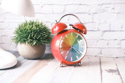 Preview: table lamp and clock on table with copy space