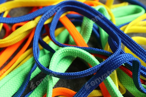 Preview: Colorful shoelaces on grey background, closeup. Stylish accessory