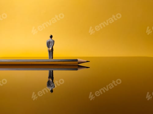 Preview: Pencil and miniature people with reflection on a yellow background