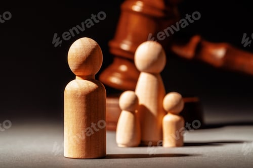 Preview: Wooden toy family and judge mallet. Family divorce concept