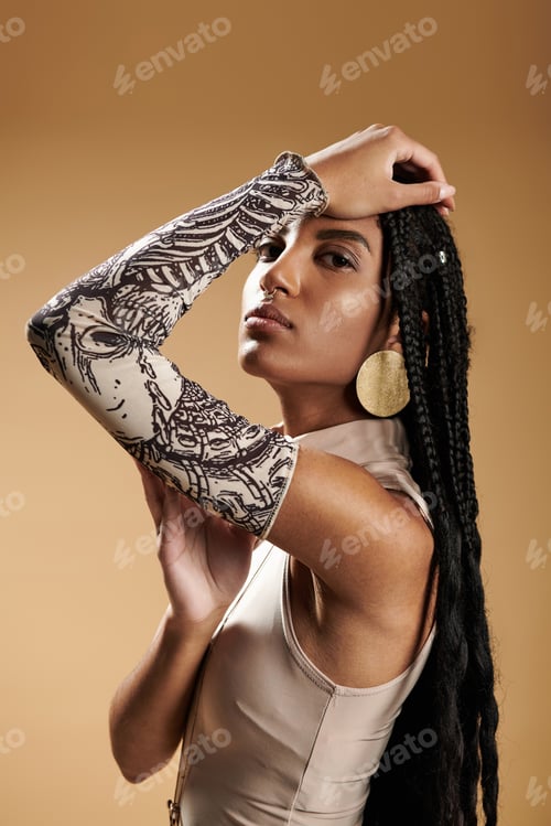 Preview: A stylish young woman showcases her unique fashion in a warm, artistic setting