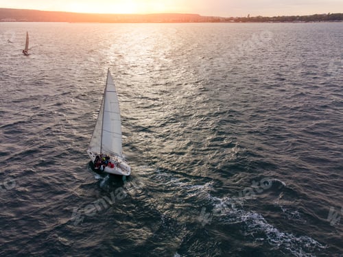 Preview: sailing yachts regatta race on sea aerial view