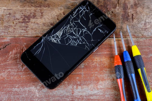 Preview: Smart phone repair with screwdriver with broken screen