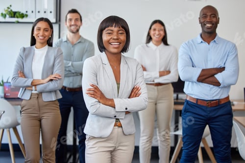 Preview: Portrait of a group of businesspeople standing together with folded arms in a modern office