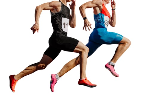 Preview: two male athletes sprinting on track stadium, muscles taut, competing fiercely