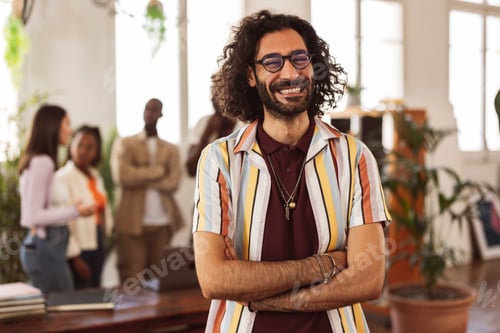 Preview: modern man in business glasses with colleagues in background