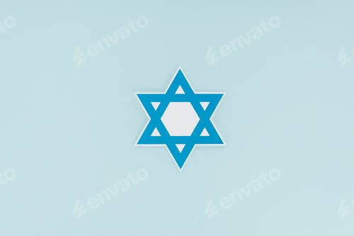 Preview: top view of traditional jewish star isolated on blue, hannukah holiday concept