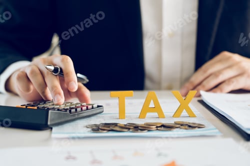 Preview: Businessman's hands calculating numbers at a calculator.Tax deduction planning concept.
