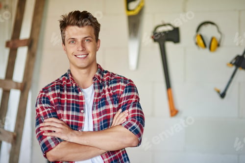 Preview: Proud and confident carpenter is posing