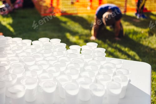 Preview: Disposable cups with water on table