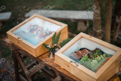 Preview: Variety of raw beef meat steaks for grilling with seasoning and utensils on dark rustic board