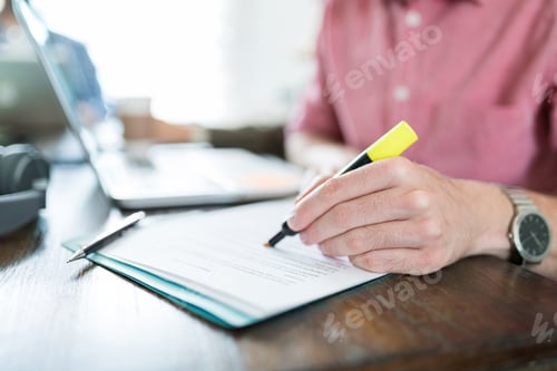 Preview: Male Professional Preparing Business Plan In Office
