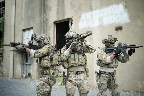 Preview: Soldier in full US MARSOC armed with assault rifle run through the abandoned building. Military