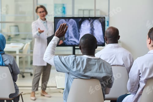 Preview: People asking questions at medical conference