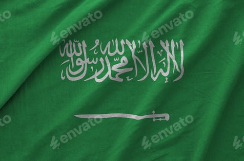 Preview: Saudi Arabia flag depicted on folded wavy fabric of old cloth