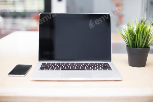 Preview: Laptop and mobile phone on a desk